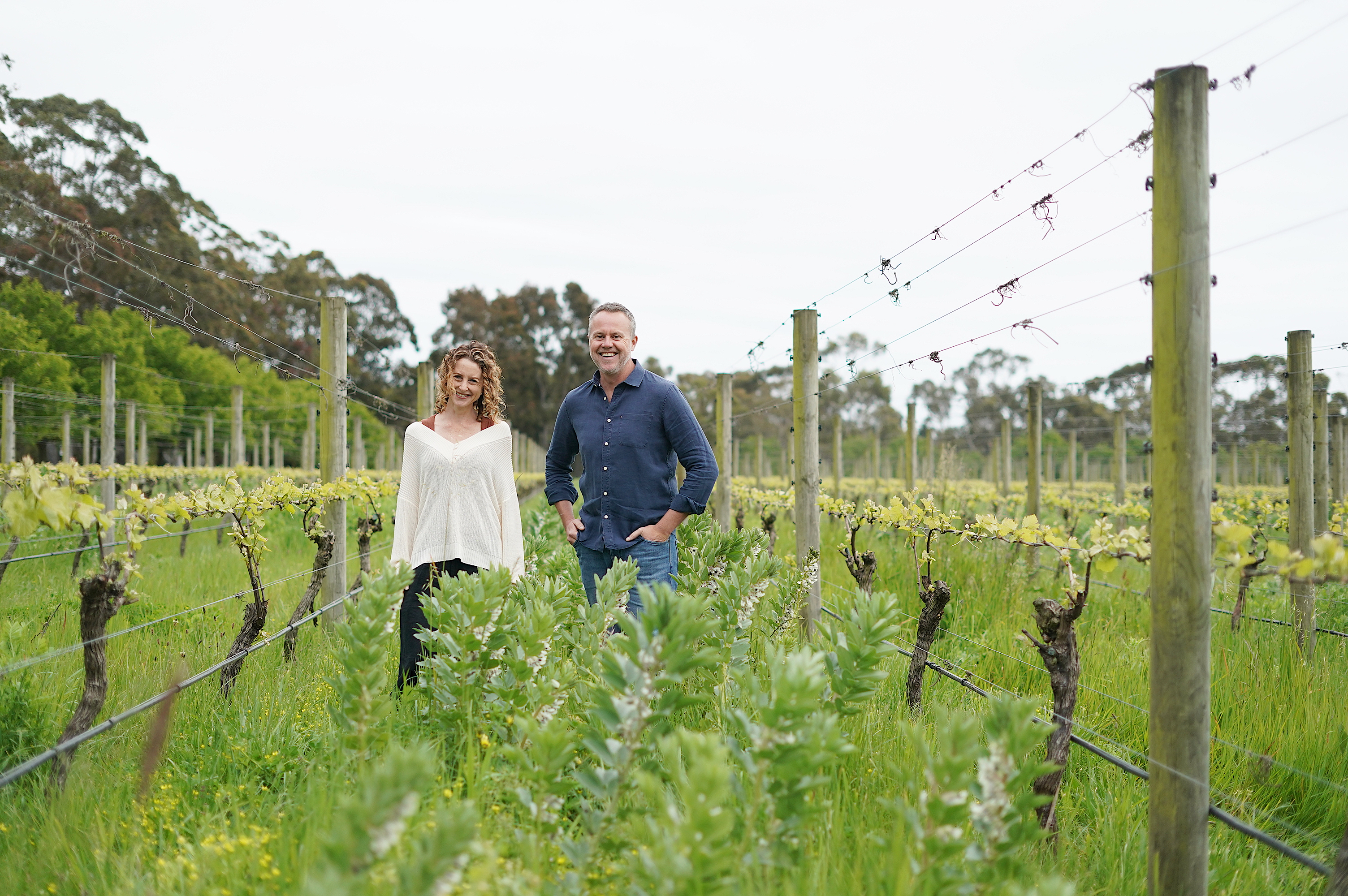 Man and woman walking in vineyard
